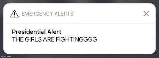 Emergency alert phone notification of a Presidential Alert that reads "The girls are fighting"